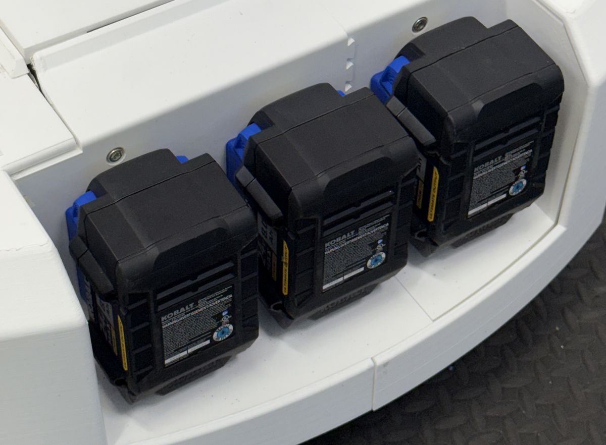 Close-up of three swappable batteries seated in the battery bay of the Sensori MobileBase platform